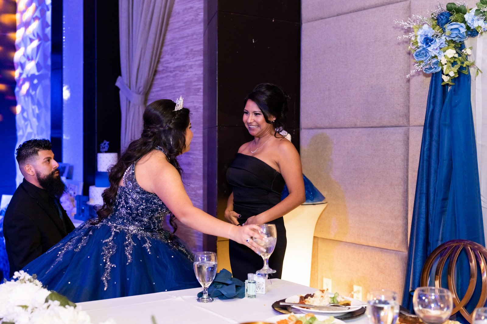 Quinceañera cake cutting with family