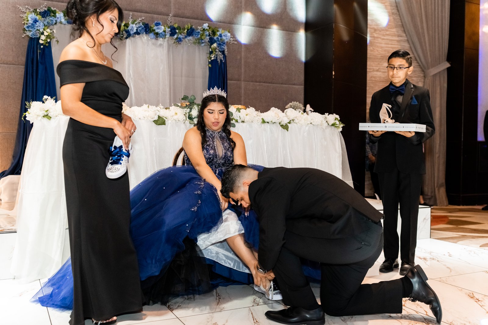 Family taking part in a quinceañera tradition